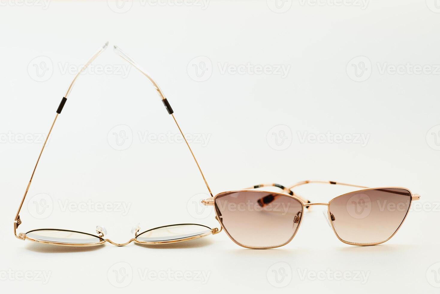 Conceptual elegant Sunglasses isolated on white background. Sun glasses summer accessories as design element for promo or advertising banner. High quality photoSunglasses on white background photo