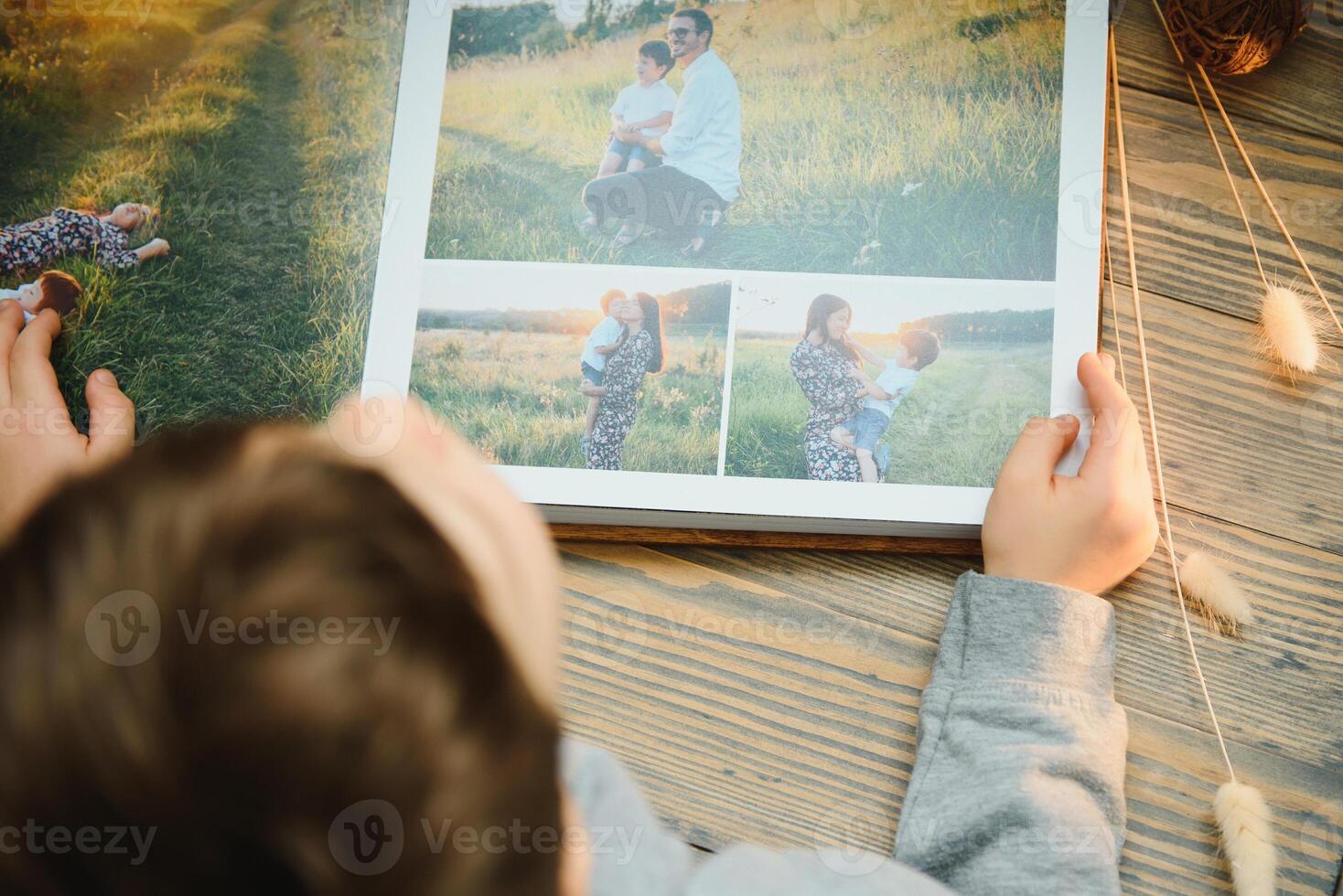 Luxury wooden photo book on natural background. Family memories photobook. Save your summer vacation memories.