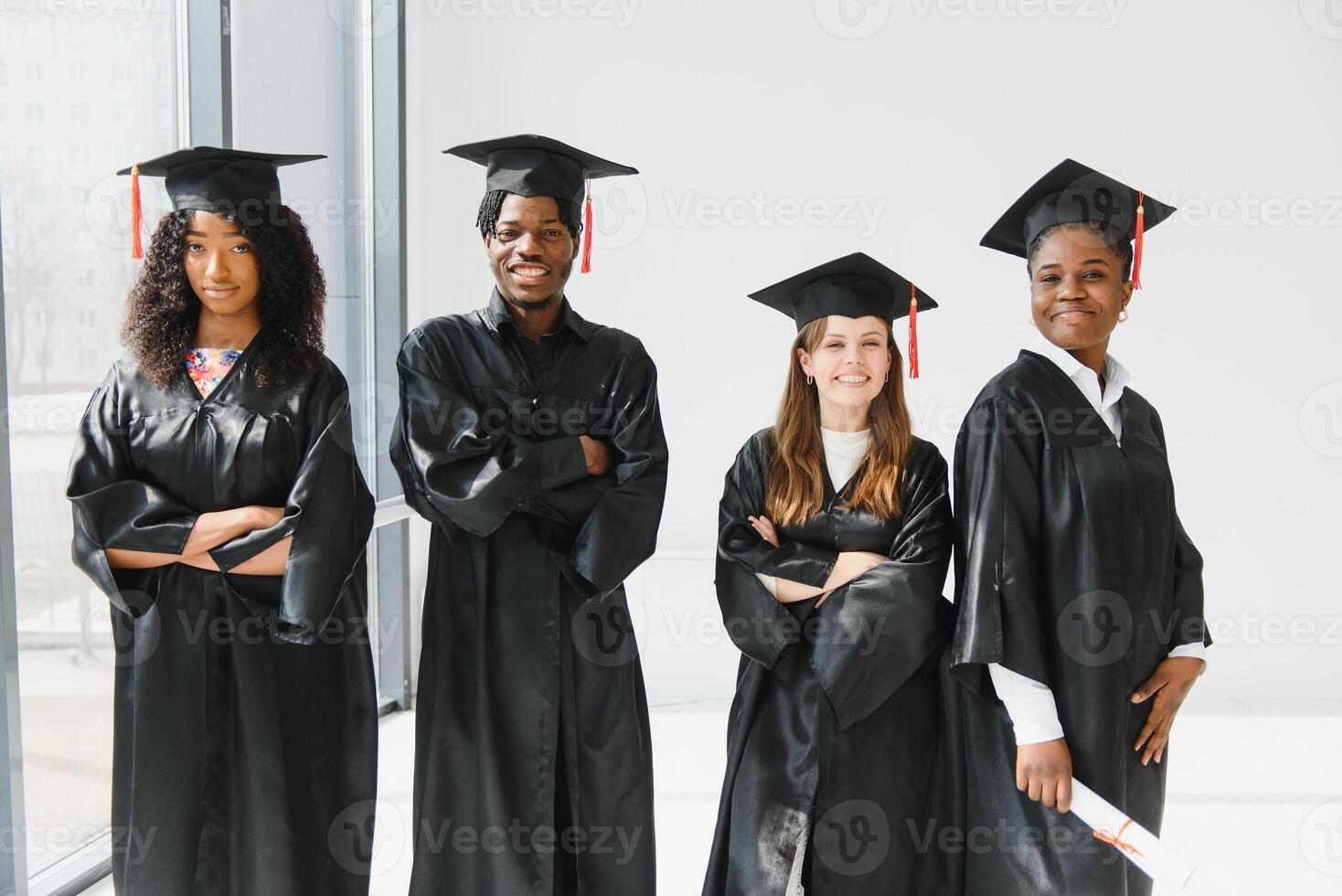 optimistic young university graduates at graduation photo
