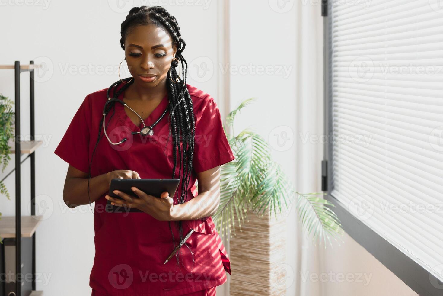 medicine, people and healthcare concept - african american female doctor or nurse at hospital. photo