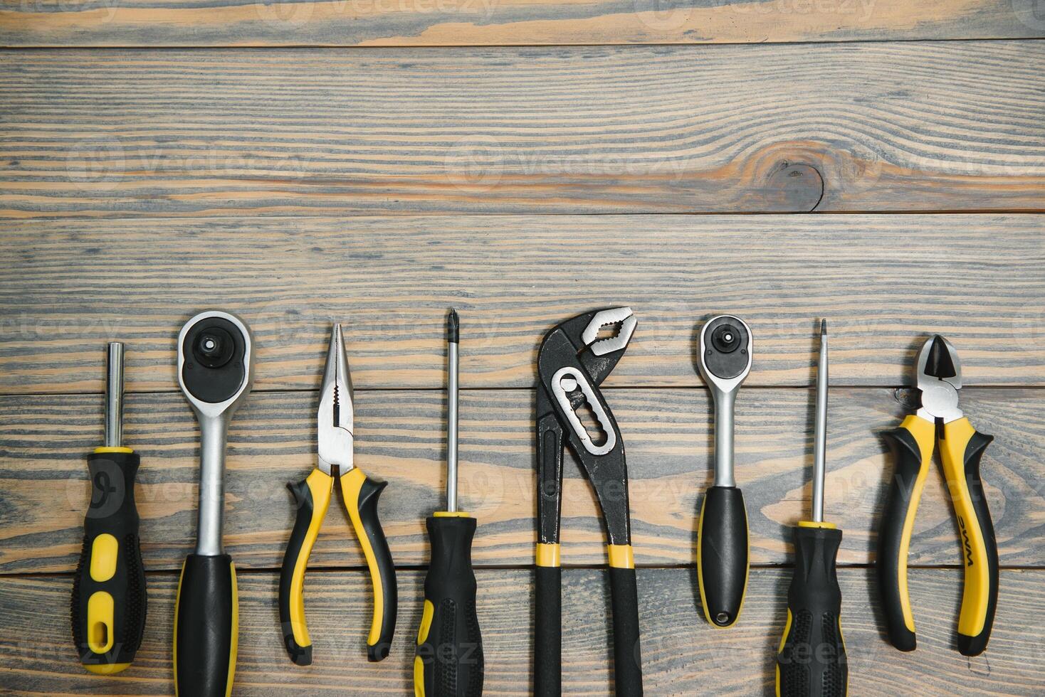 Different tools on a wooden background. photo
