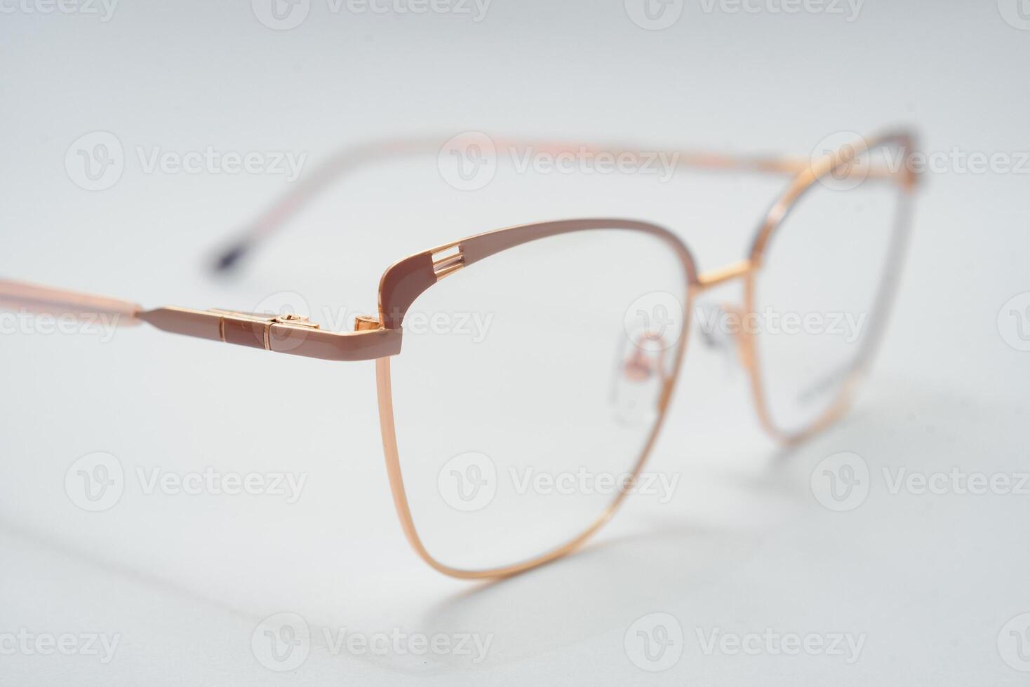 Female eyeglasses macro detail over a white background. Horizontal photo