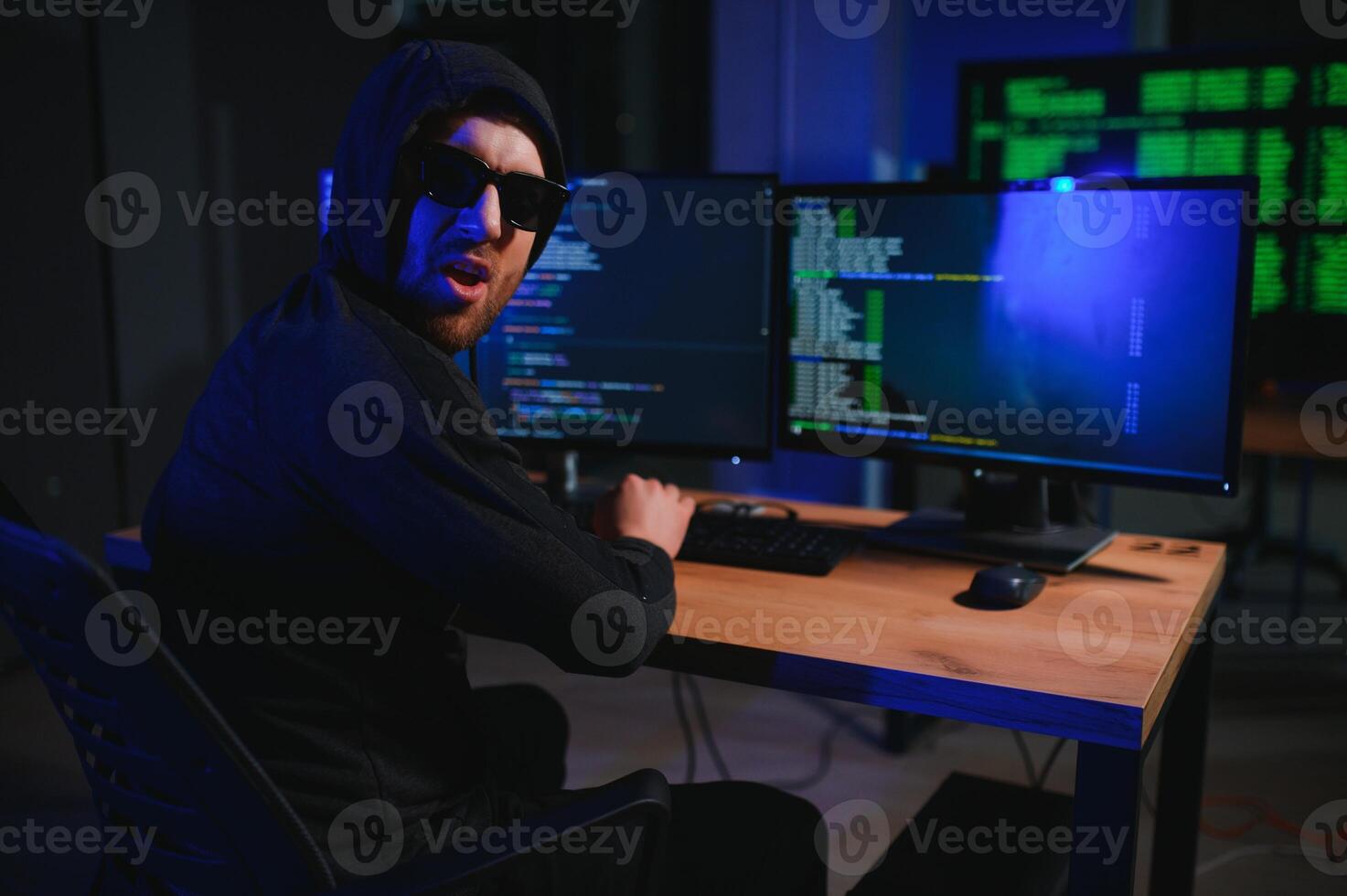 Hacker is hacking into the computer network. Computer criminal photo