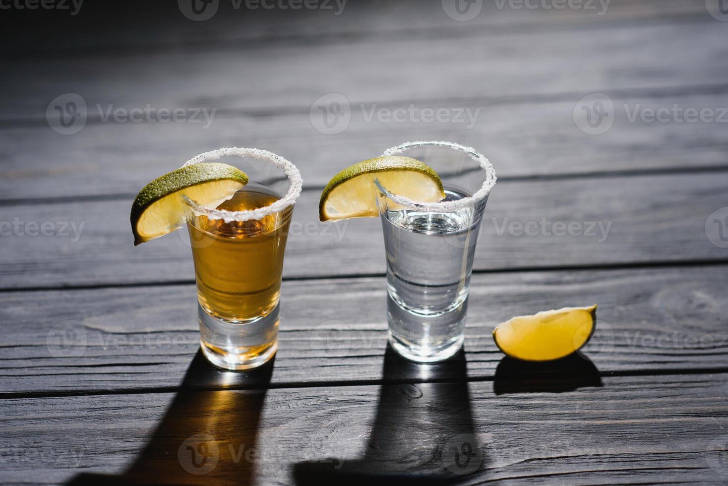 Mexican tequila with lime and salt on rustic wood background. space for text. concept luxury drink. Alcoholic drink concept. photo
