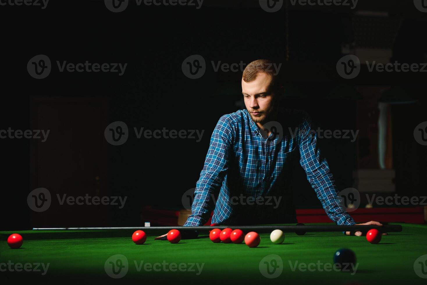 Playing billiard - Close-up shot of a man playing billiard photo