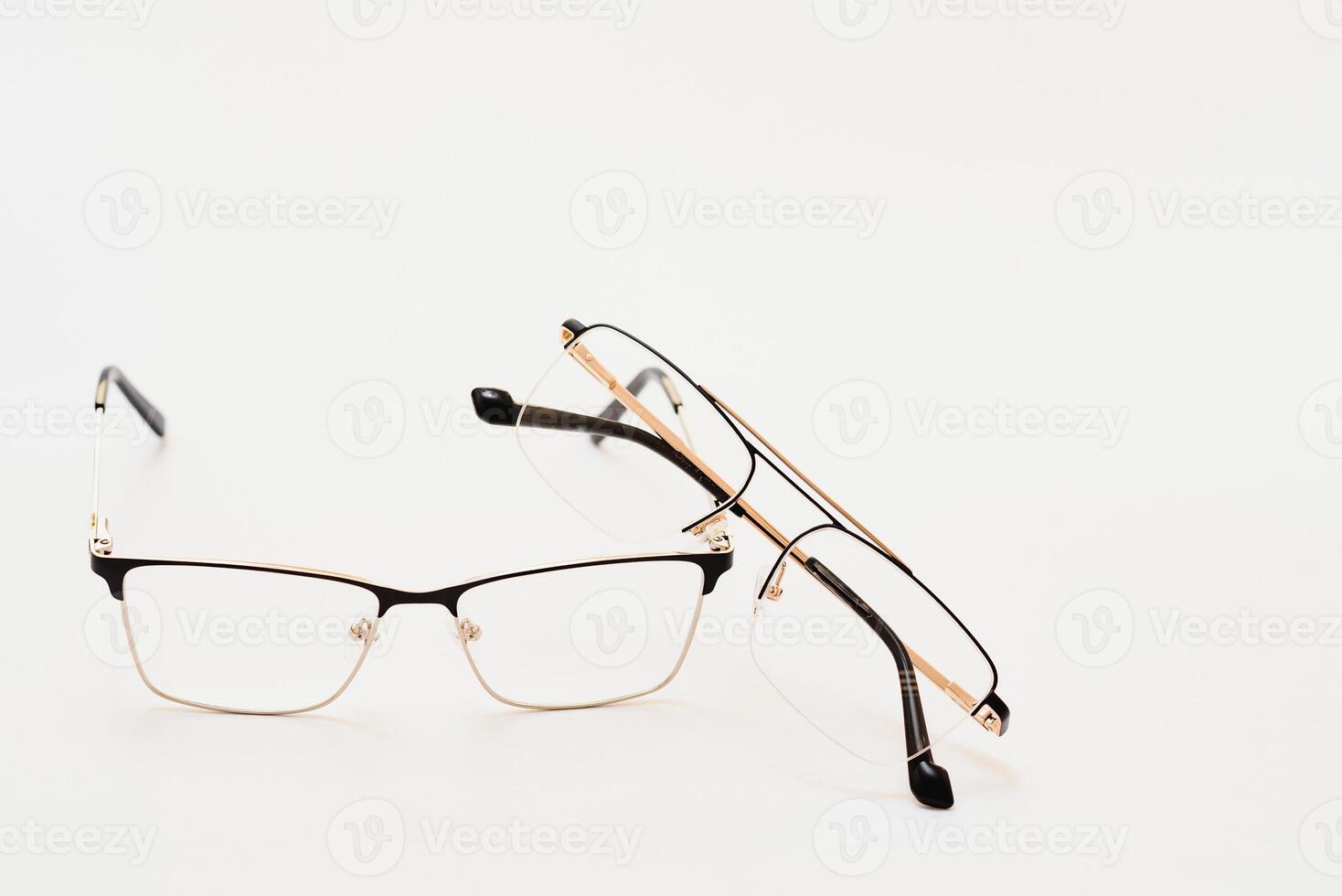 Stylish eyeglasses over background. Optical store, glasses selection, eye test, vision examination at optician, fashion accessories concept. Top view, flat lay photo