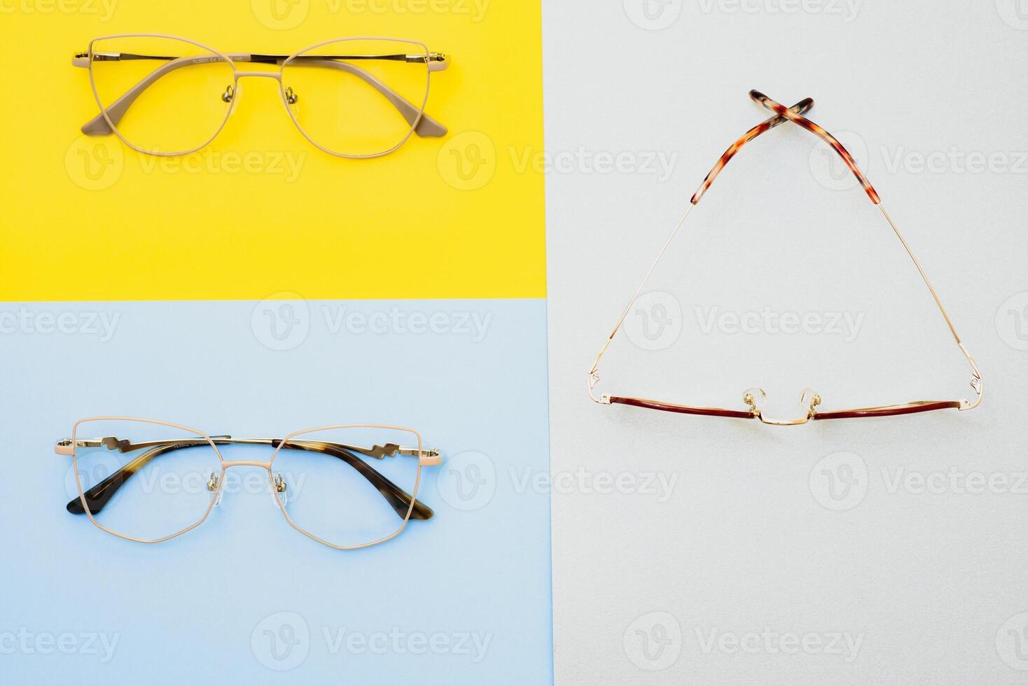 Stylish eyeglasses. Modern eyeglass frames on a colored background photo