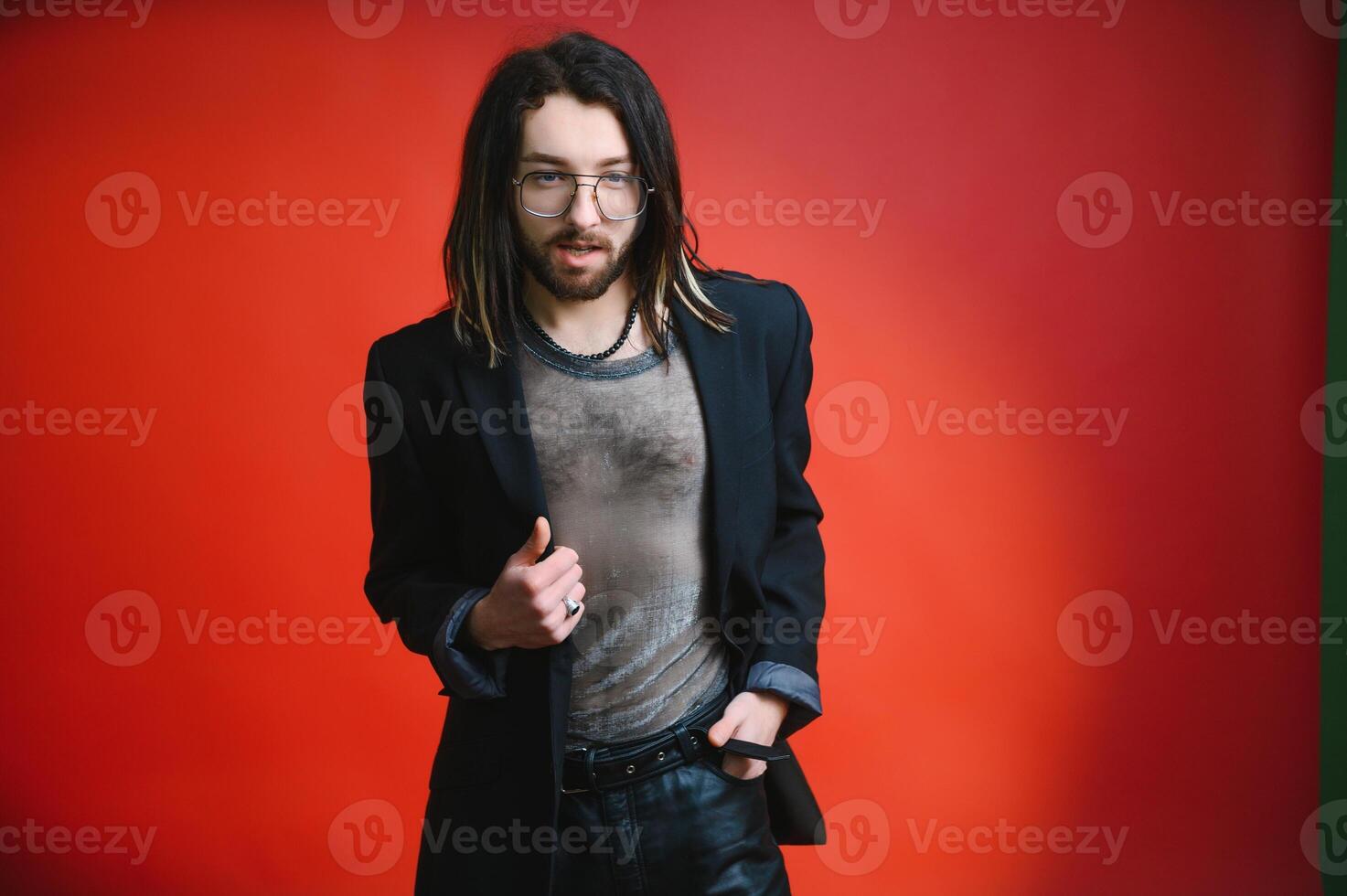 Gay man on a colored background in the studio. The concept of the LGBTQ community. Equality. photo