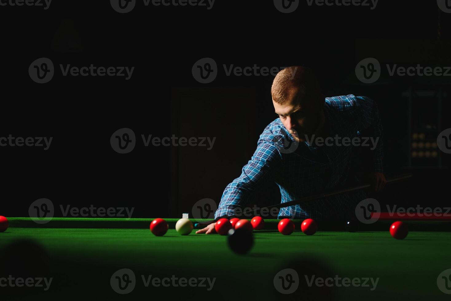 Playing billiard - Close-up shot of a man playing billiard photo