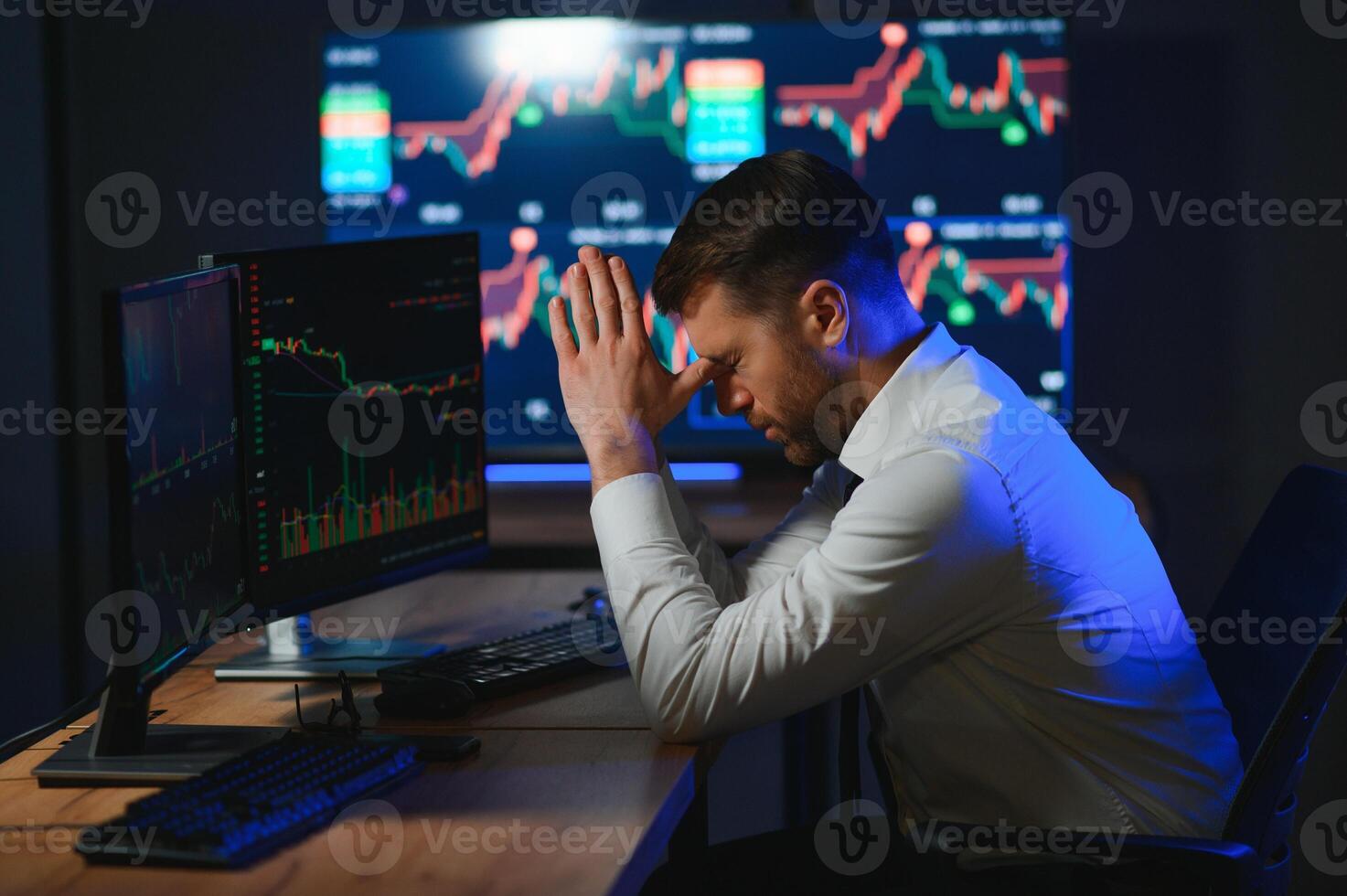 Tired overworked bearded man, crypto trader having headache, lost money photo