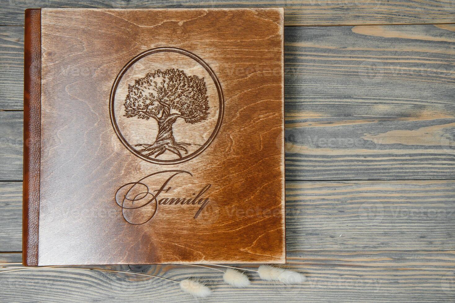 Luxury wooden photo book on natural background. Family memories photobook. Save your summer vacation memories.