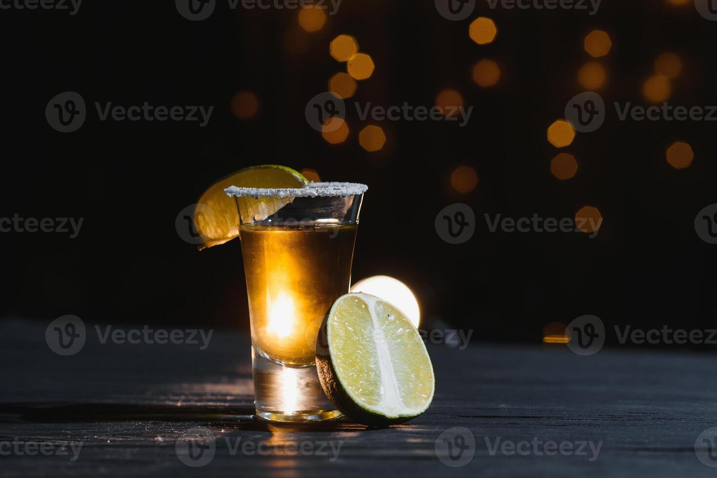 Mexican tequila with lime and salt on rustic wood background. space for text. concept luxury drink. Alcoholic drink concept. photo