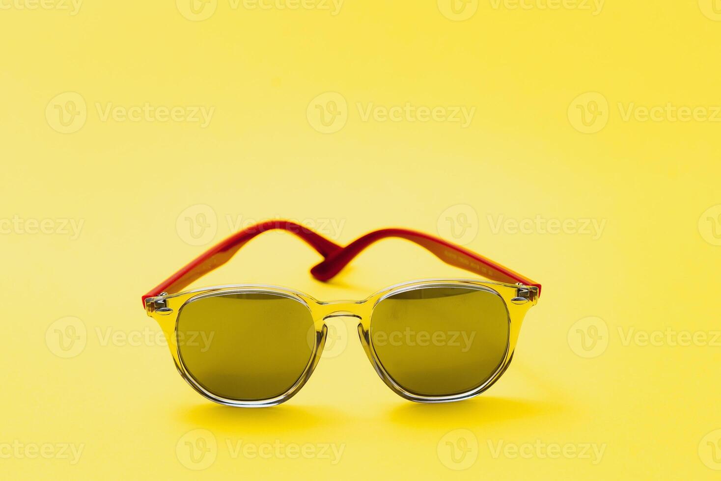 Stylish sunglasses on a yellow background High quality photo Sunglasses.