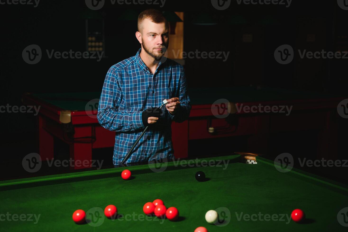 Playing billiard - Close-up shot of a man playing billiard photo