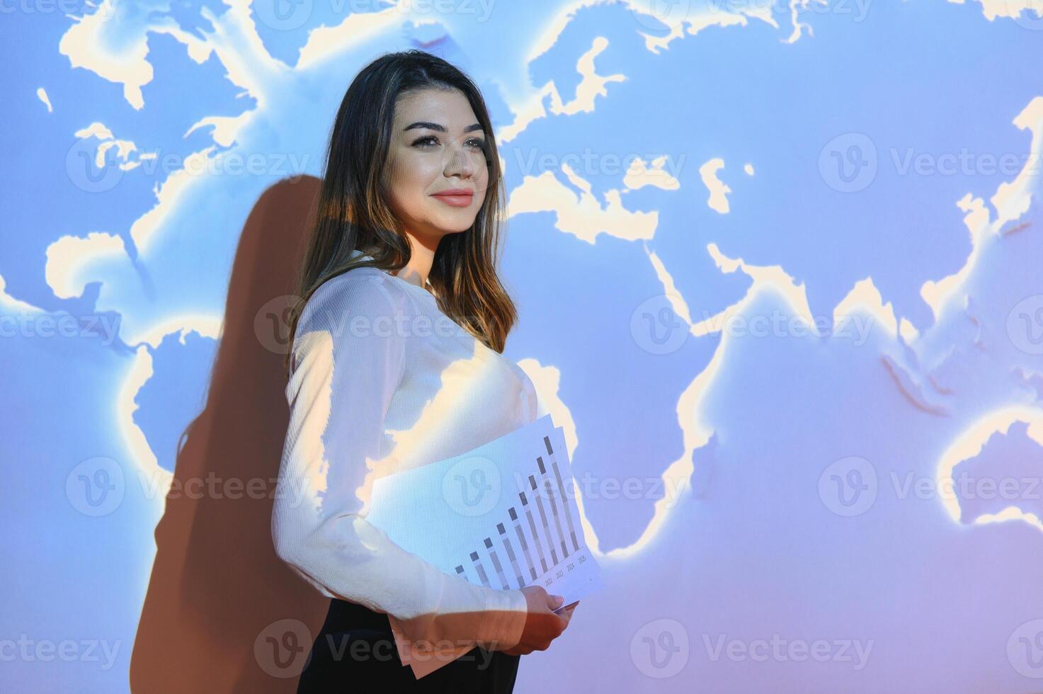 Global business network concept. businesswoman on the background of the world map, international economy. photo