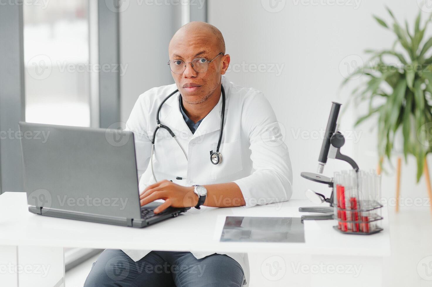 young male african doctor in hospital. photo