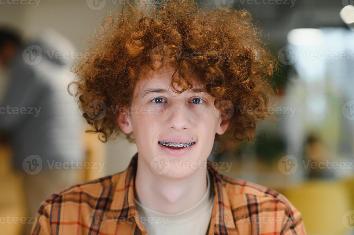 Headshot of happy redhead man, smiling excited at camera. photo