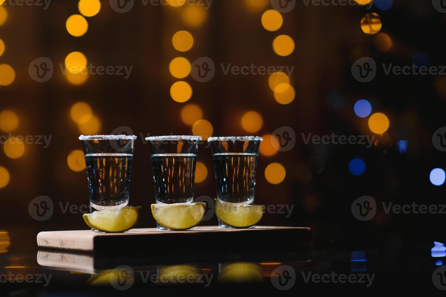 tequila with lime on a dark background photo