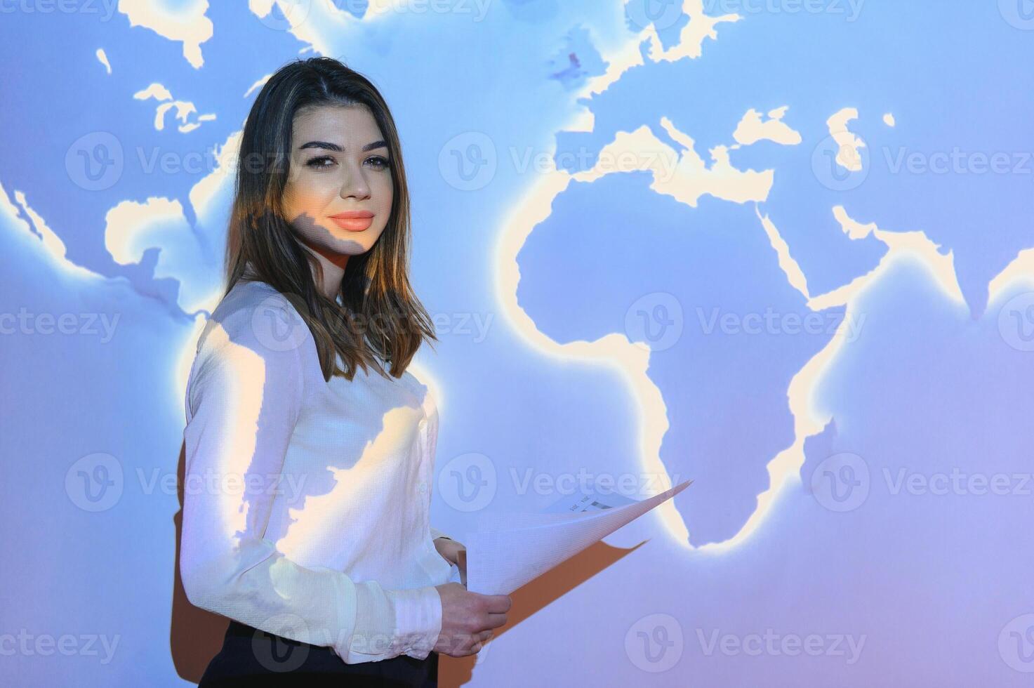 Buinesswoman with world map background photo