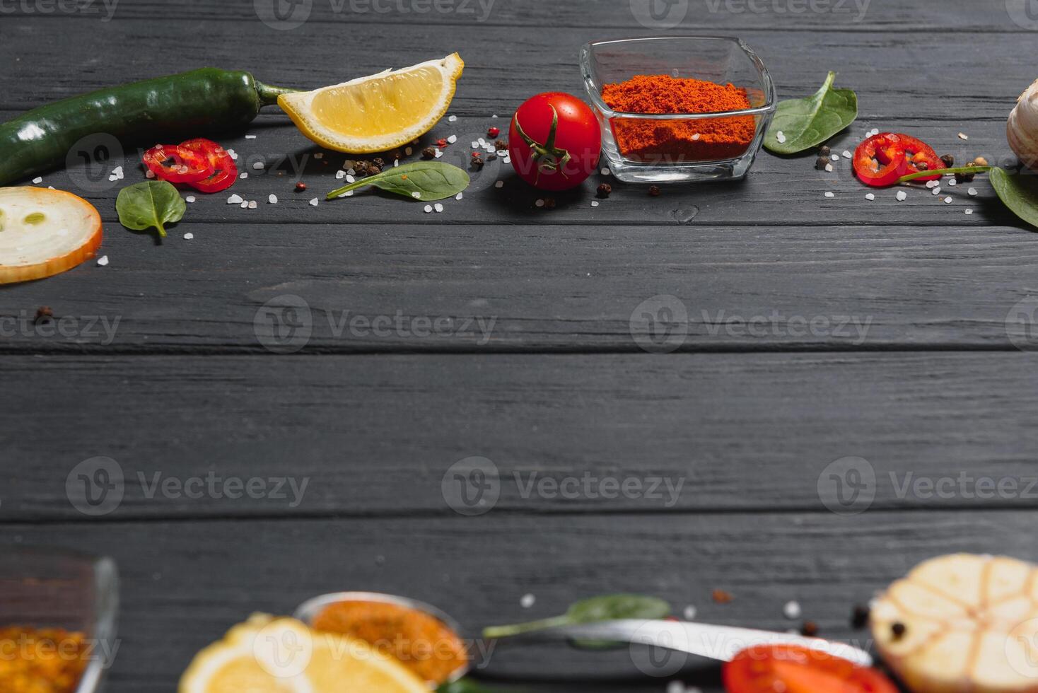 Cooking table. Background with spices and vegetables. Top view. Free space for your text. photo