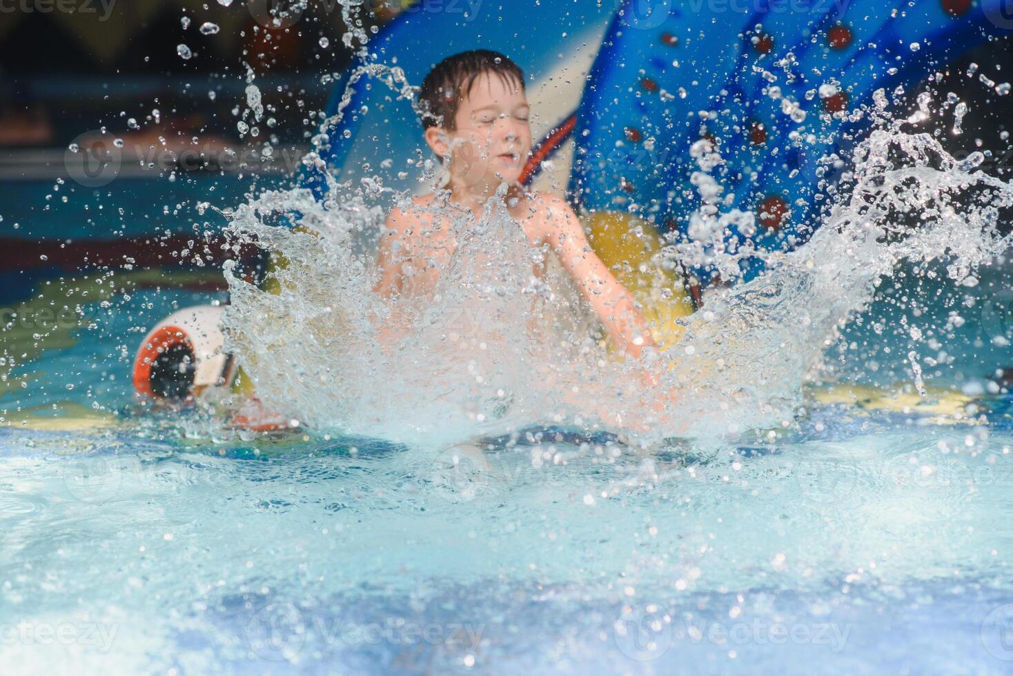 boy is in the water park. photo