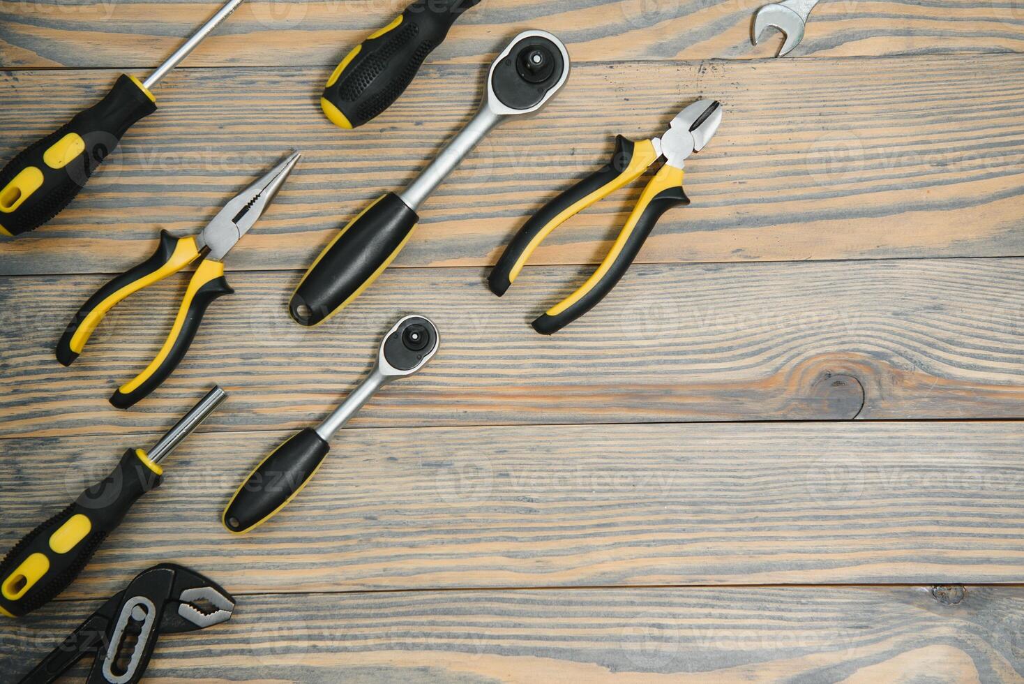 Various tools on wooden background photo