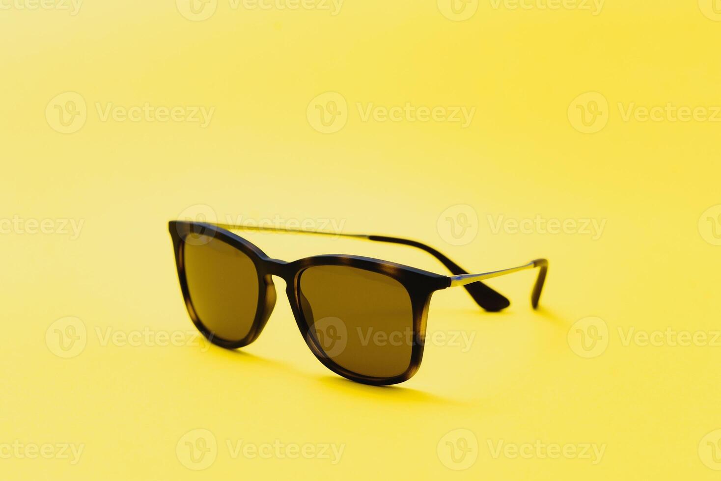 Stylish sunglasses on a yellow background High quality photo Sunglasses.