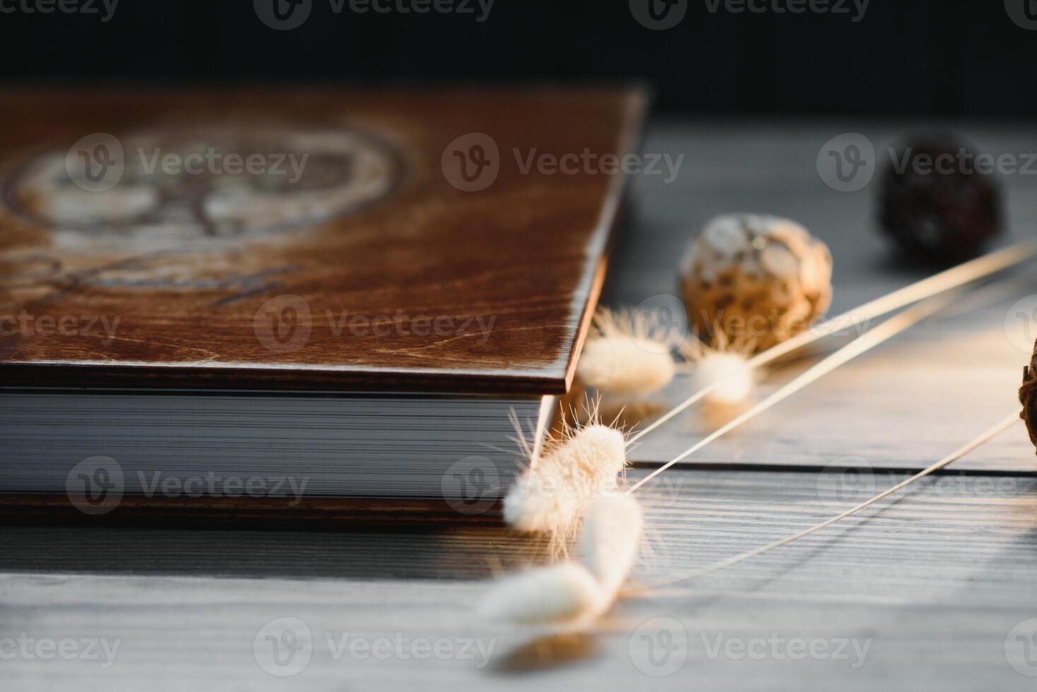 Luxury wooden photo book on natural background. Family memories photobook. Save your summer vacation memories. Photo album wedding photoalbum with wooden cover.