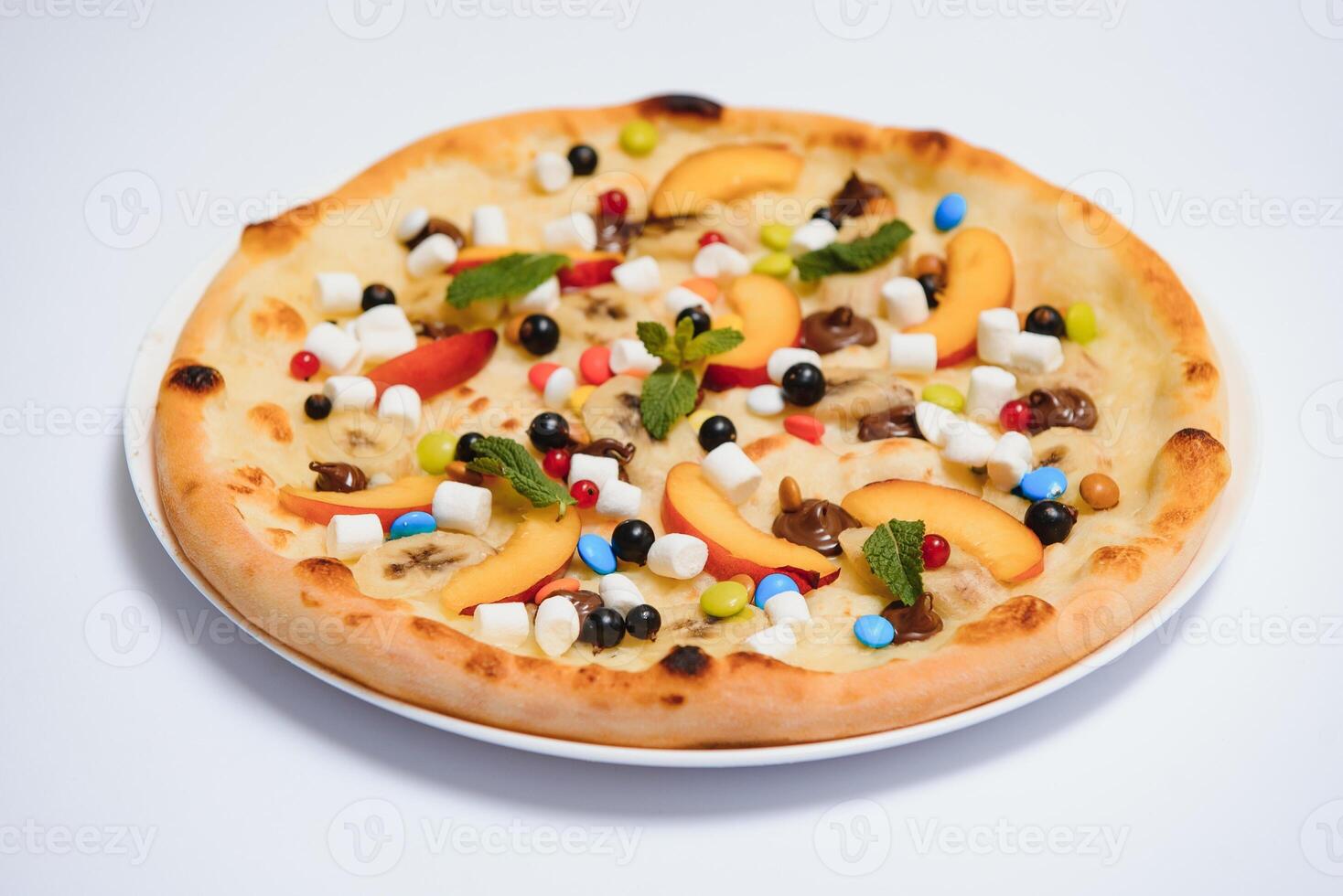 Sweet pizza with marshmallow sauce and colored sweets, chocolate pizza with colored sweets and chocolate pizza with banana on a white background photo