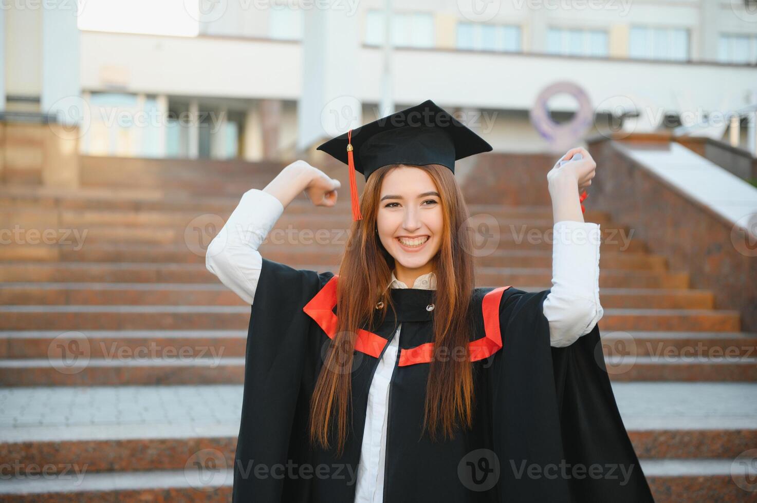 Graduation Student Standing With Diploma photo