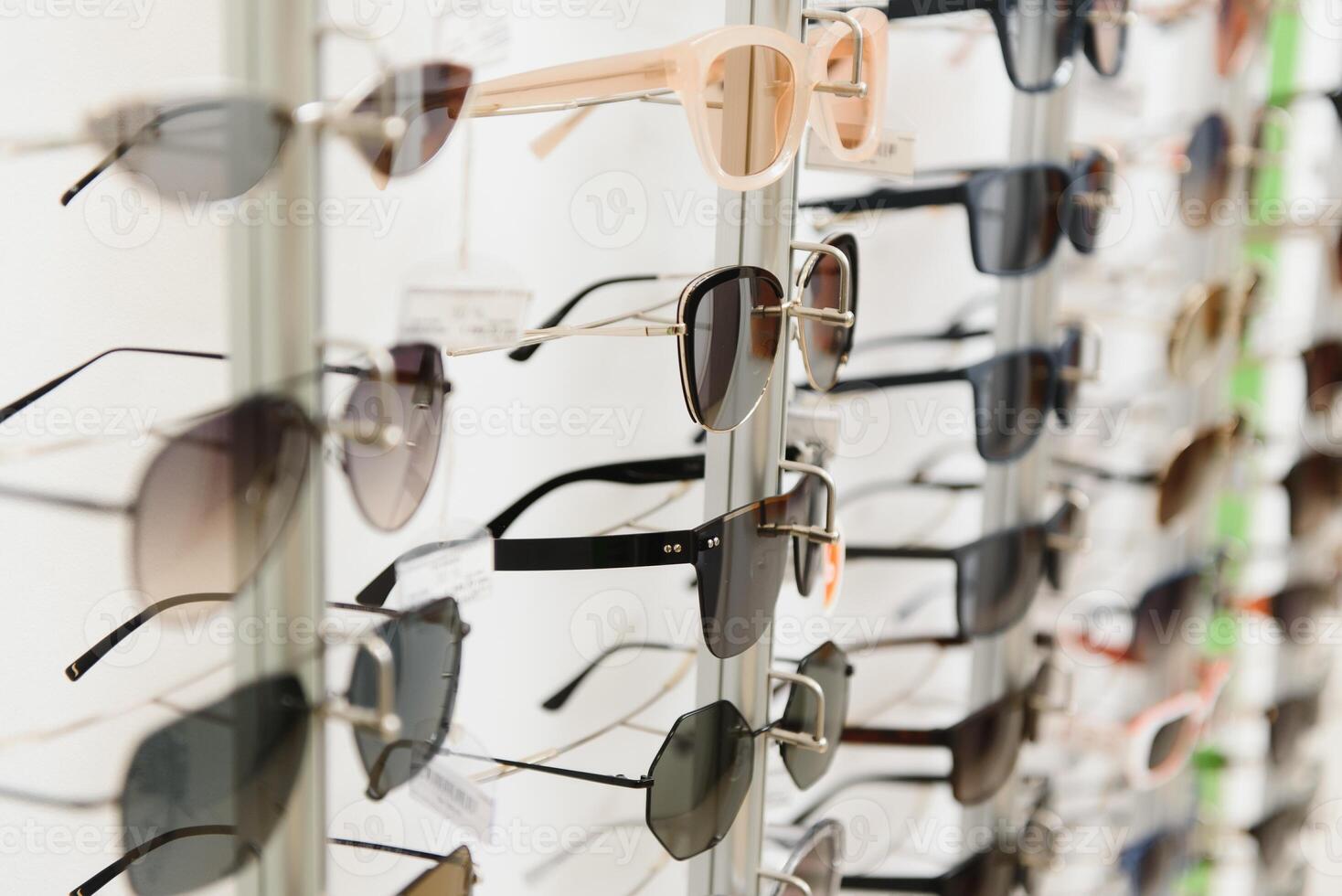 rack with glasses and sunglasses close up. photo