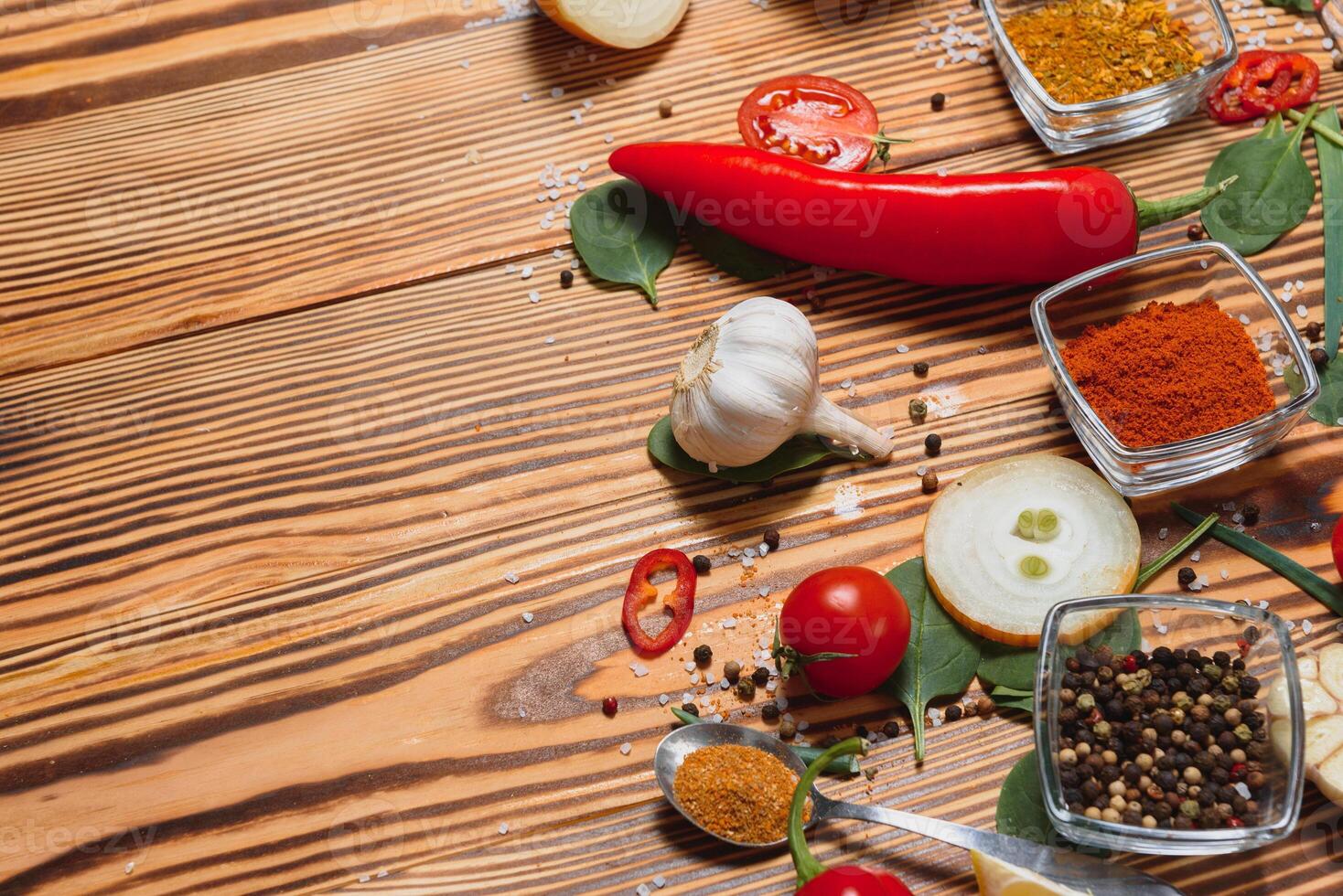 Cooking table. Background with spices and vegetables. Top view. Free space for your text. photo