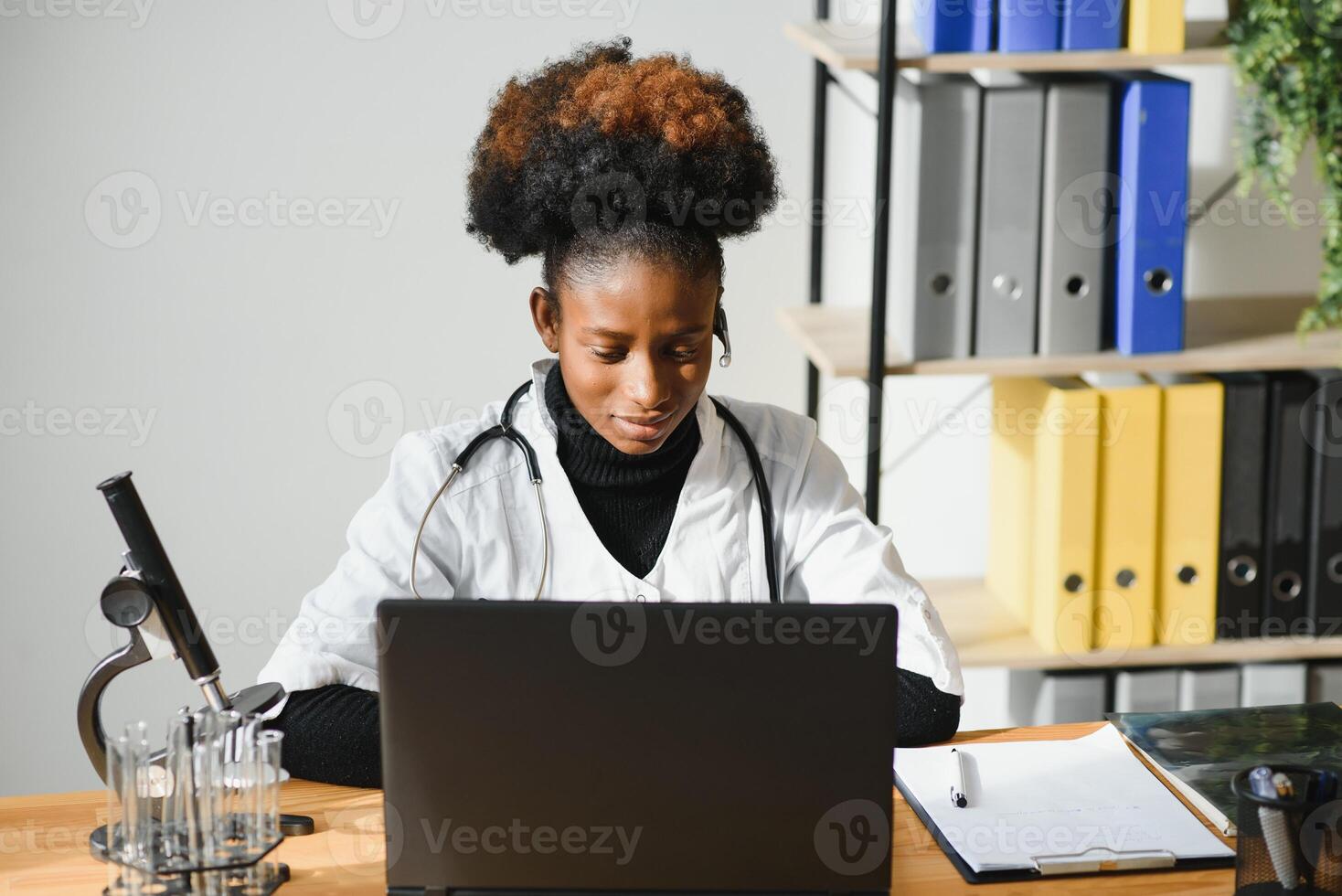 African female doctor consulting patient make online webcam video call on laptop. Black woman therapist videoconferencing in remote computer healthcare telemedicine virtual chat. Telehealth videocall photo