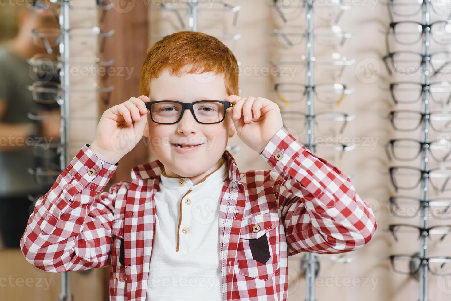 boy in glasses , at optics store. photo