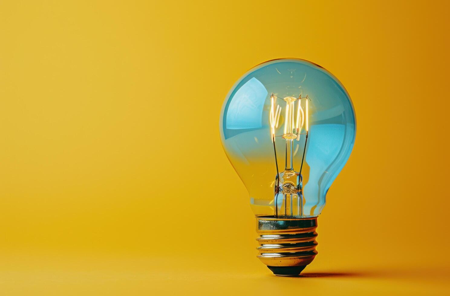AI generated dim light bulb isolated on a yellow background photo