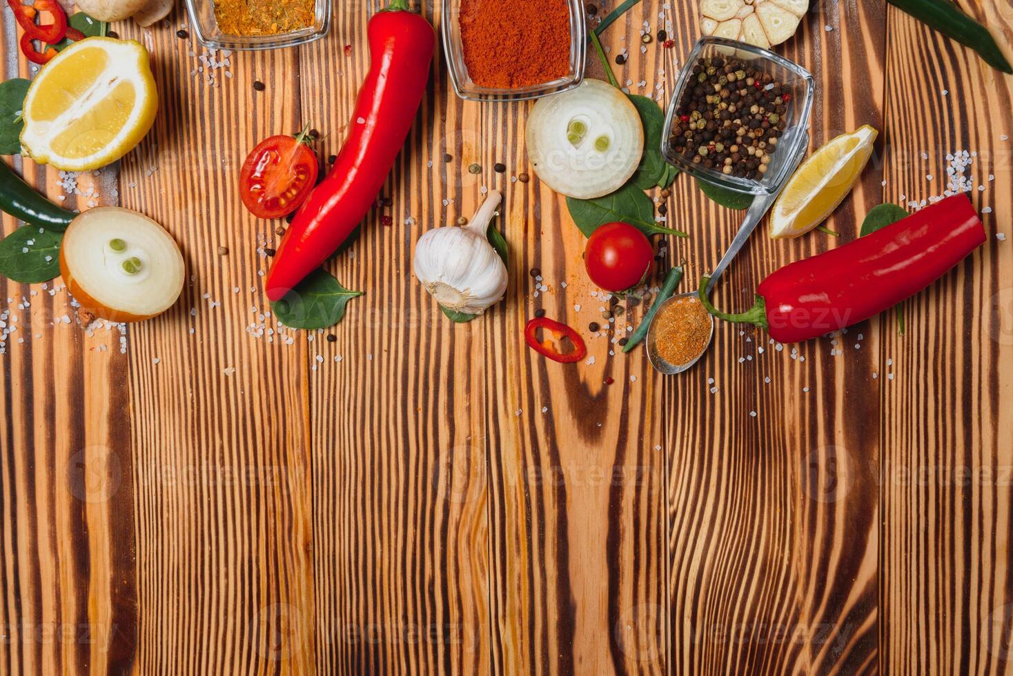 Cooking table. Background with spices and vegetables. Top view. Free space for your text. photo