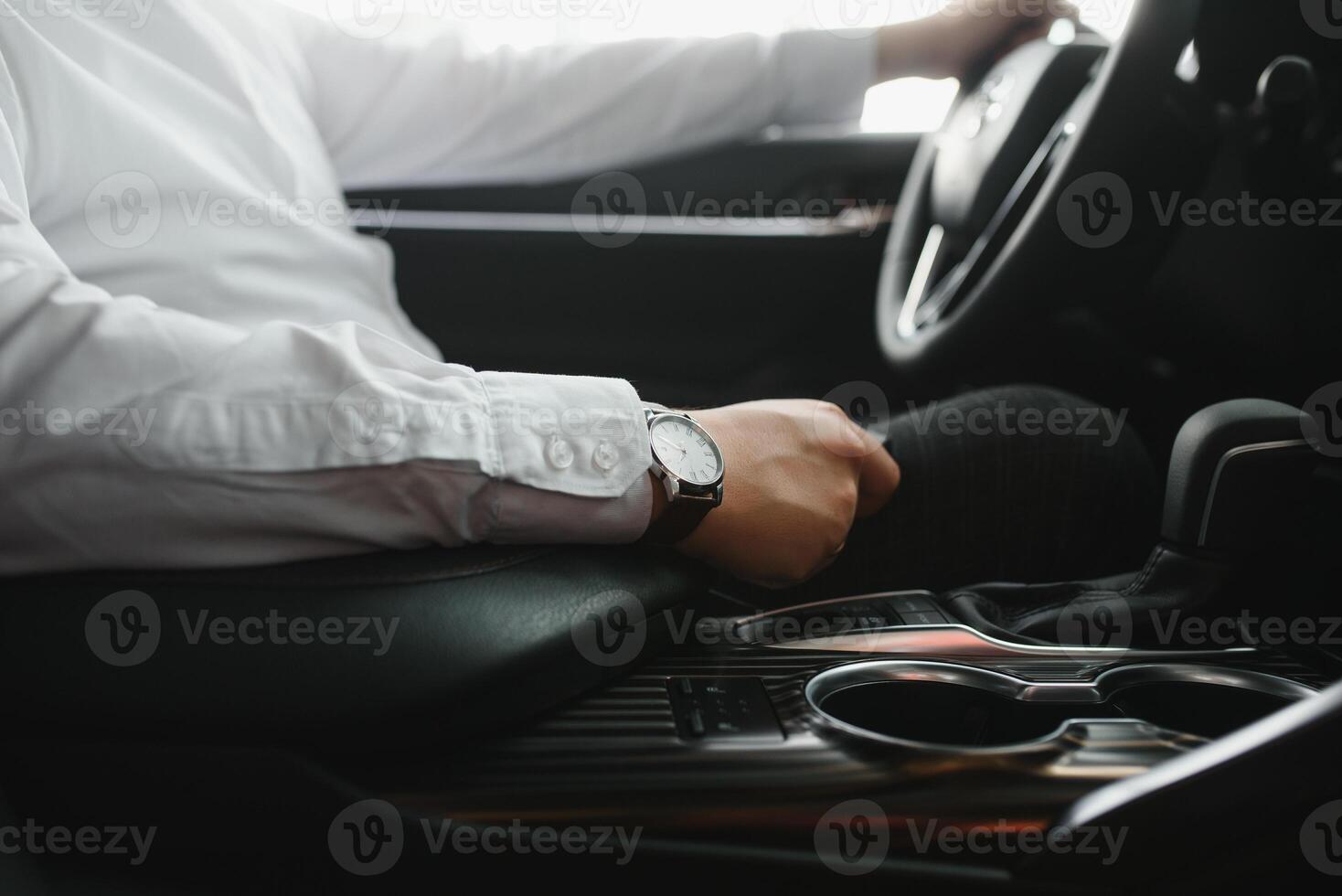 Close-up Of Person's Hand Changing Gear While Driving Car. photo