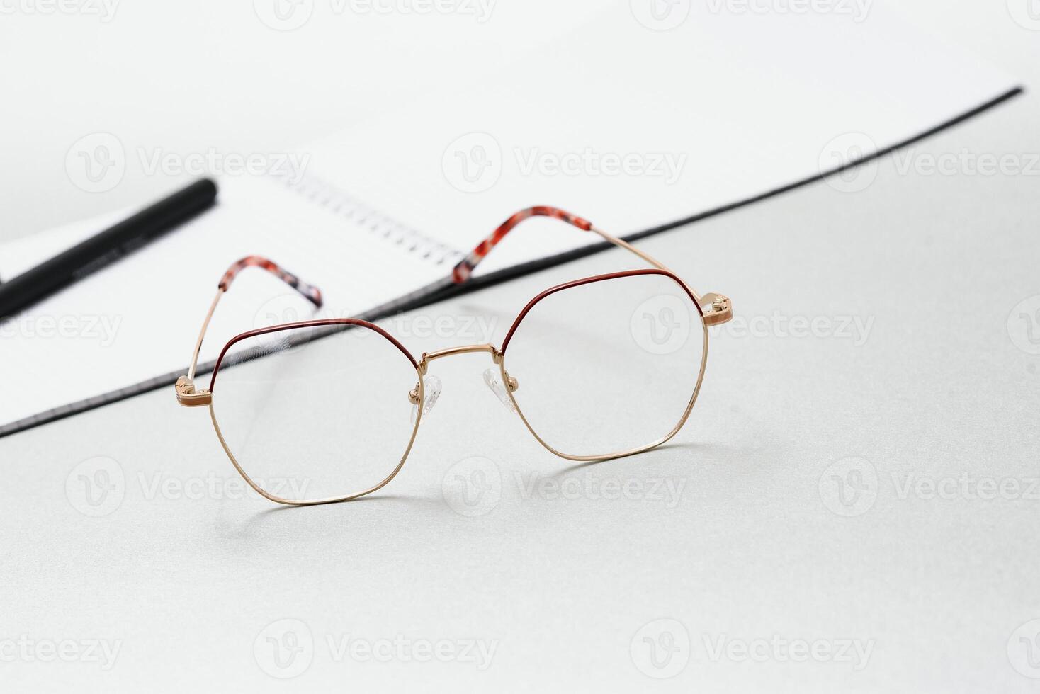 notebook, glasses, pen on a white background top view, school, education, knowledge photo