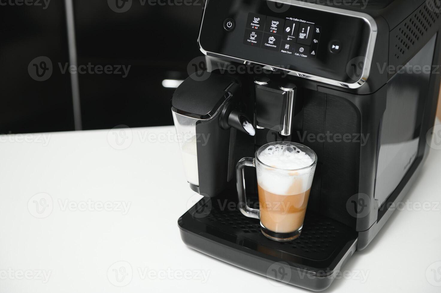 Home professional coffee machine with cappuccino cup. coffee machine latte macchiato cappuccino milk foam prepare concept photo