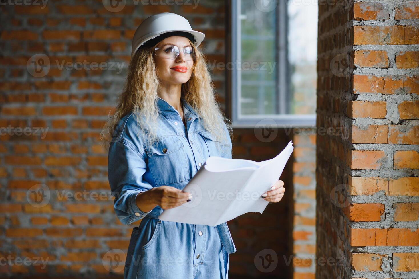 Warehouse woman worker. Woman builder in hardhat. Girl engineer or architect. Home renovation. Quality inspector. Construction job occupation. Construction worker. Lady at construction site. photo