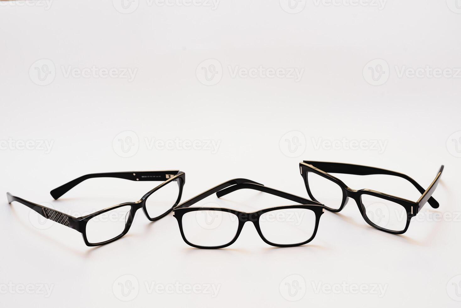 Black glasses on a white background, hipster style, plastic frames, the concept of poor vision photo