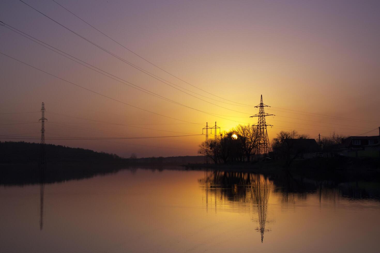 Sunset landscape. Pond at sunset time. Evening color of sky. photo