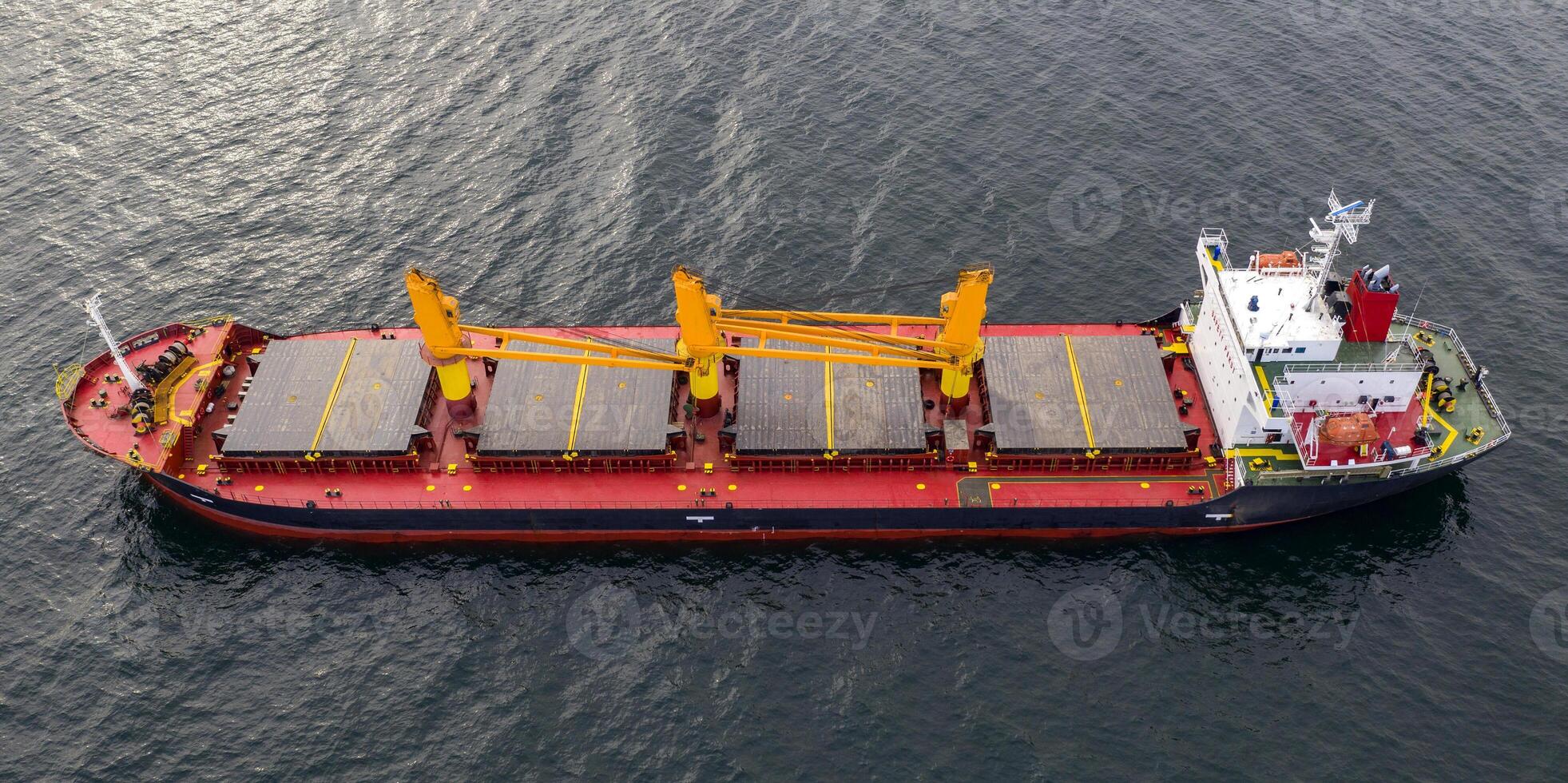 Big ship at sea. Aerial top view of cargo ship vessel import-export sailing. photo