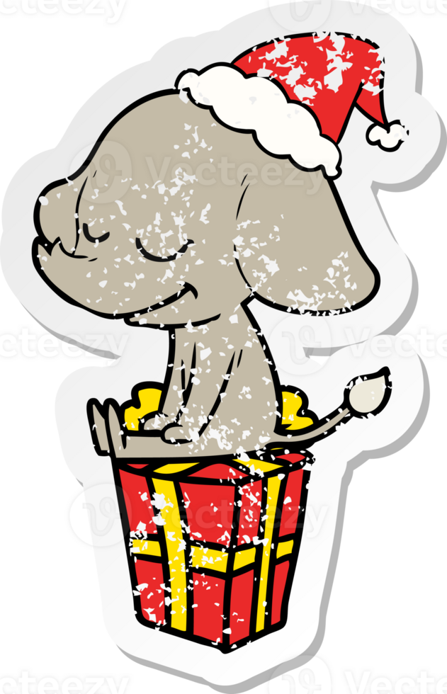 hand drawn distressed sticker cartoon of a smiling elephant wearing santa hat png