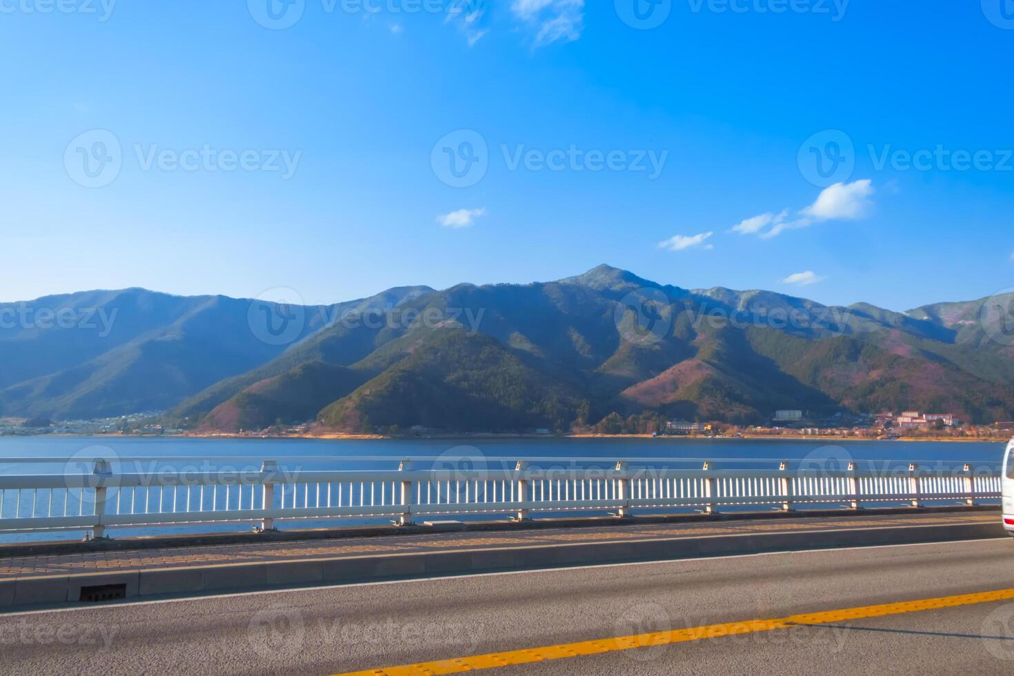 Kawaguchiko Ohashi bridge at Kawaguchi lake with Mountain and sky photo