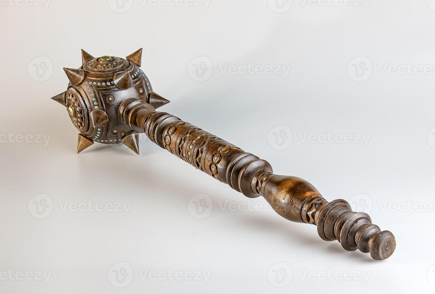 Souvenir wooden Hetman's Mace on a stand on a white background. Ukraine. photo