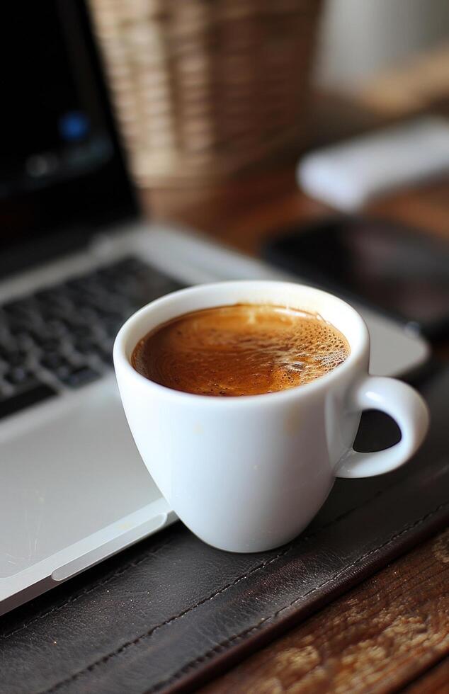 AI generated A cup of coffee sits beside a laptop on a coffee table photo