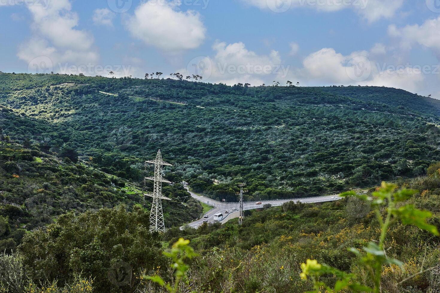 Peaceful Green Hills and Cloudy Blue Sky Landscape with Vibrant Colors photo