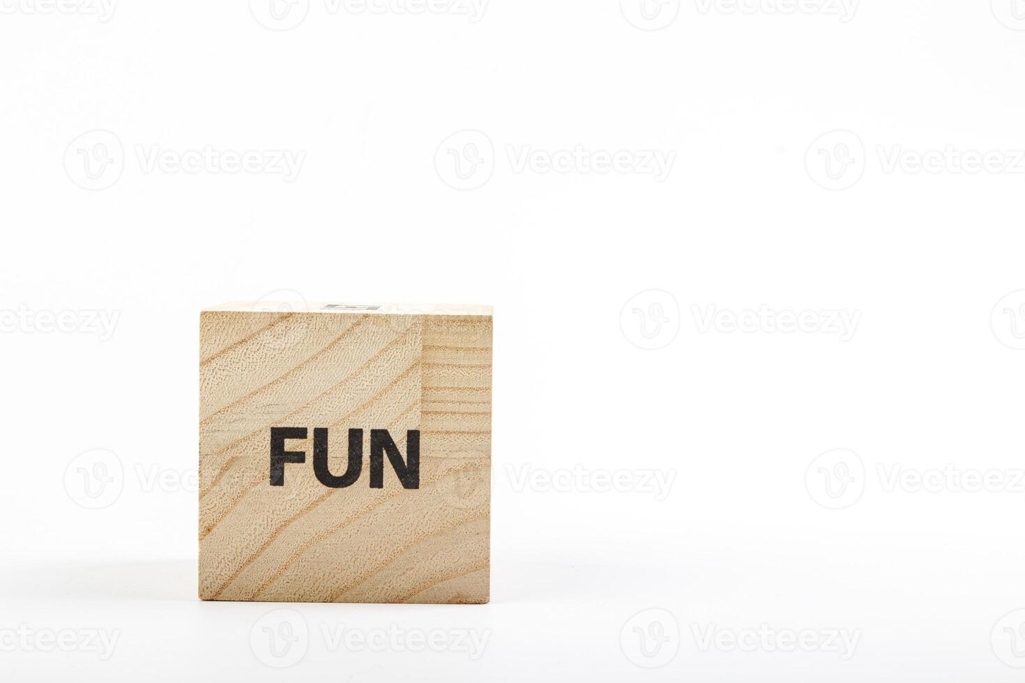 Wooden cubes with the inscription fun on a white background photo