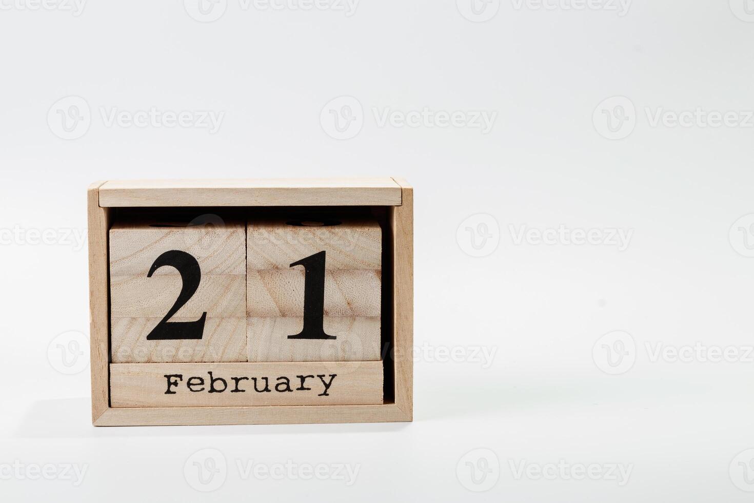 Wooden calendar February 21 on a white background photo